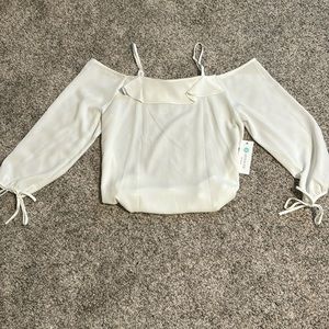 Ruffle detail cold shoulder blouse